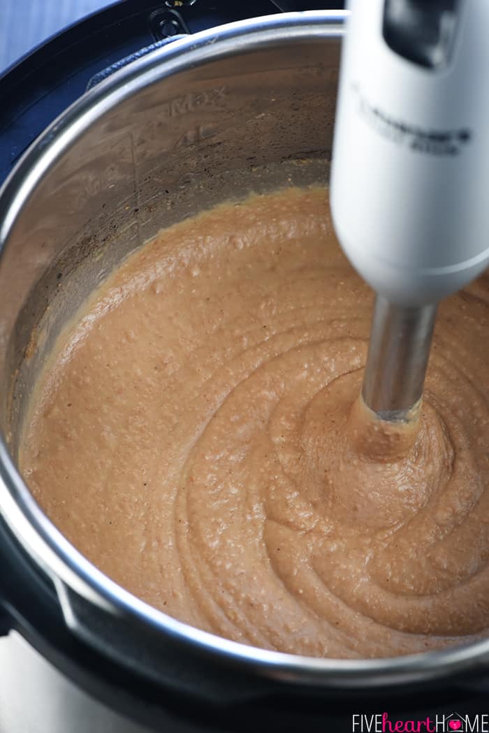 Final step of pureeing the Instant Pot Refried Bean recipe.