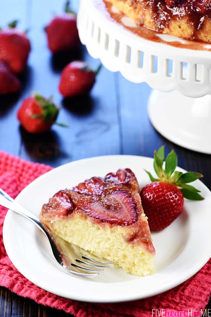 Slice of Strawberry Upside-Down Cake on white plate.