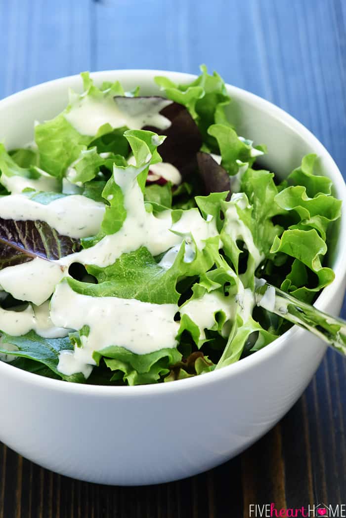 Ranch dressing made with Ranch Dressing Mix drizzled over a green salad.