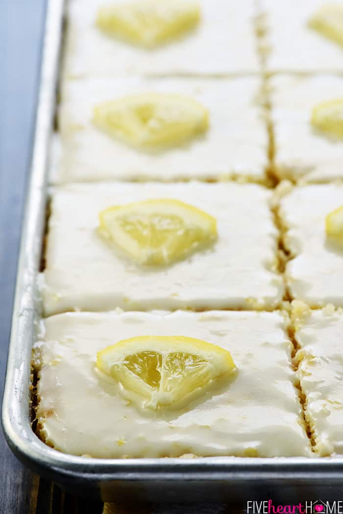 Lemon Texas Sheet Cake cut into slices in sheet pan.