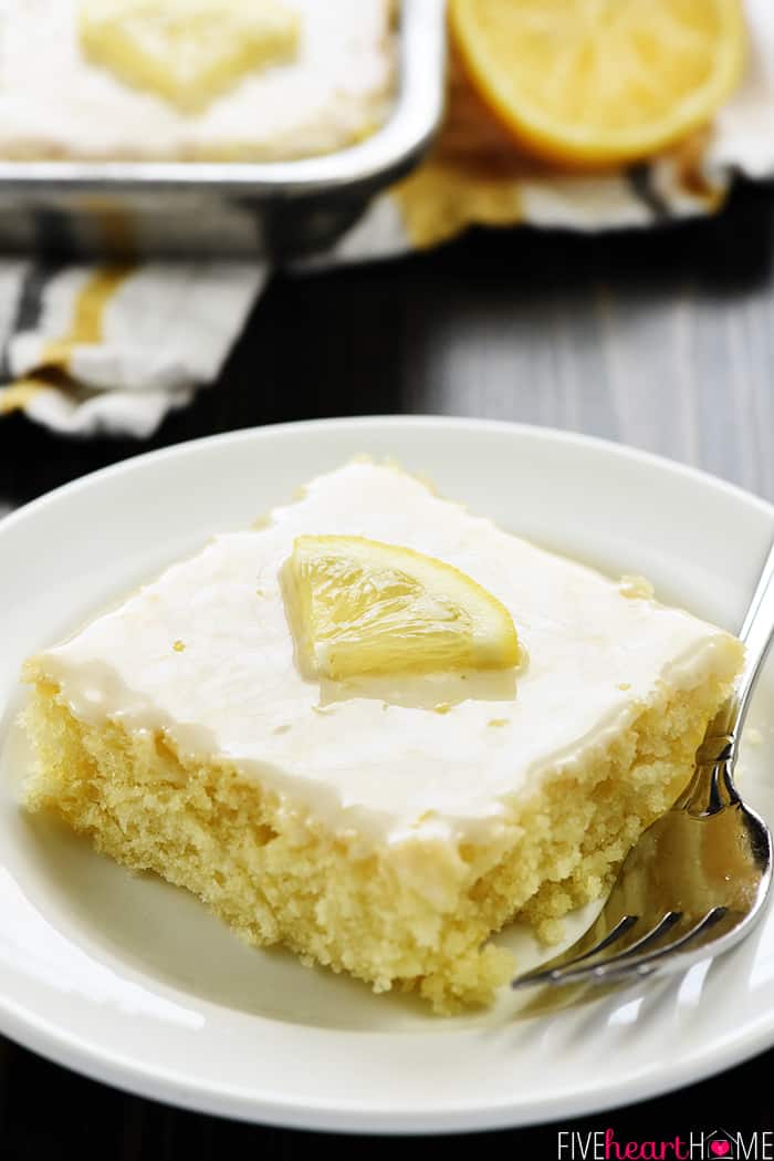 Slice of Lemon Sheet Cake on plate with fork.