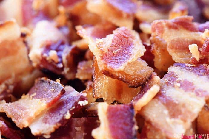 Cobb Pasta Salad ~ loaded with bacon, avocado, tomatoes, hard-boiled eggs, cheese, and homemade ranch dressing, this is the perfect recipe for summer picnics, potlucks, parties, and barbecues! | FiveHeartHome.com Close-up of diced bacon.