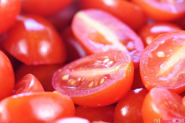 Close-up of halved grape tomatoes.