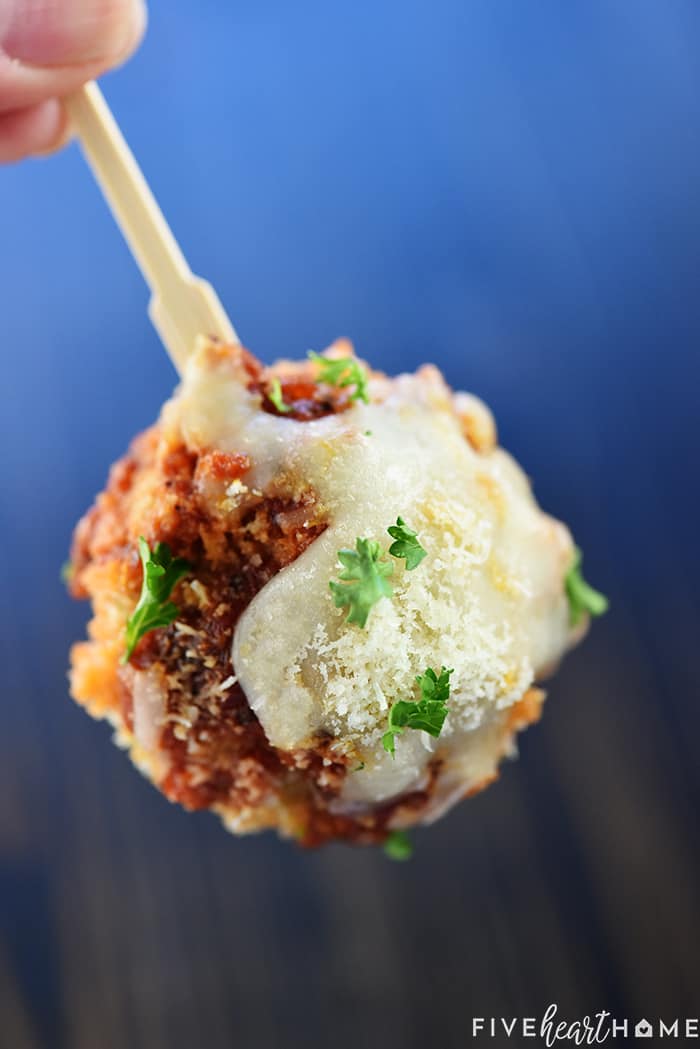 Chicken Parmesan Meatballs ~ a ground chicken mixture is formed into meatballs, rolled in Panko and Parmesan, baked, and then covered in flavorful marinara sauce and melted mozzarella...perfect for serving as an appetizer, over pasta, or on subs! | FiveHeartHome.com On a toothpick as an appetizer.