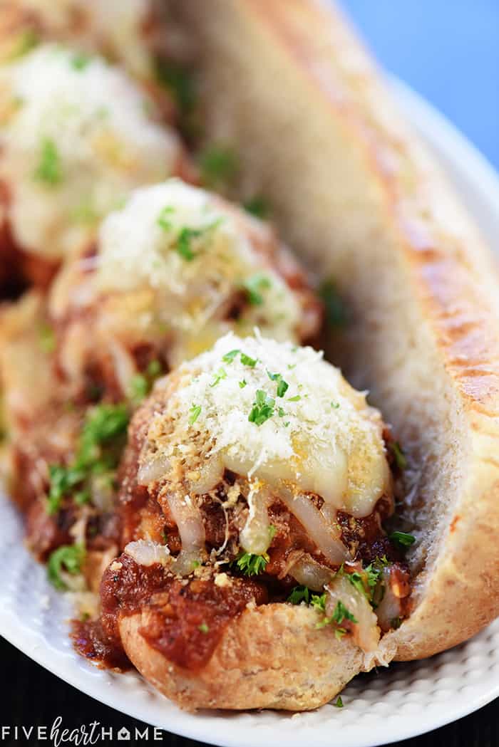 Chicken Parmesan Meatballs ~ a ground chicken mixture is formed into meatballs, rolled in Panko and Parmesan, baked, and then covered in flavorful marinara sauce and melted mozzarella...perfect for serving as an appetizer, over pasta, or on subs! | FiveHeartHome.com Chicken Parmesan Meatball sub sandwich.