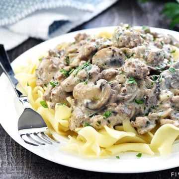 Ground Beef Stroganoff ~ a delicious, quick and easy version of the classic, loaded with garlicky mushrooms and finished off with a silky sour cream sauce! | FiveHeartHome.com