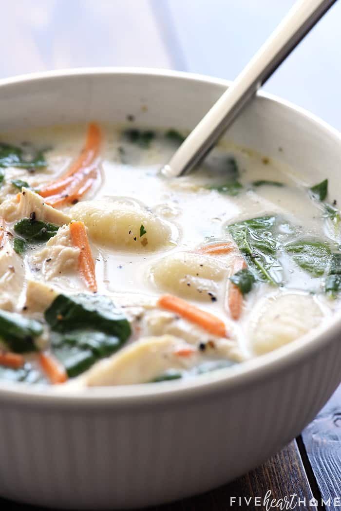 Close-up of bowl of soup with spoon.