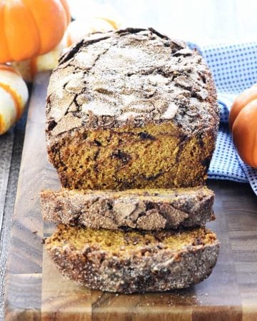 Sliced Snickerdoodle Pumpkin Bread on a cutting board