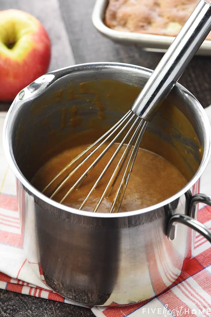 Pot of Caramel Frosting with whisk