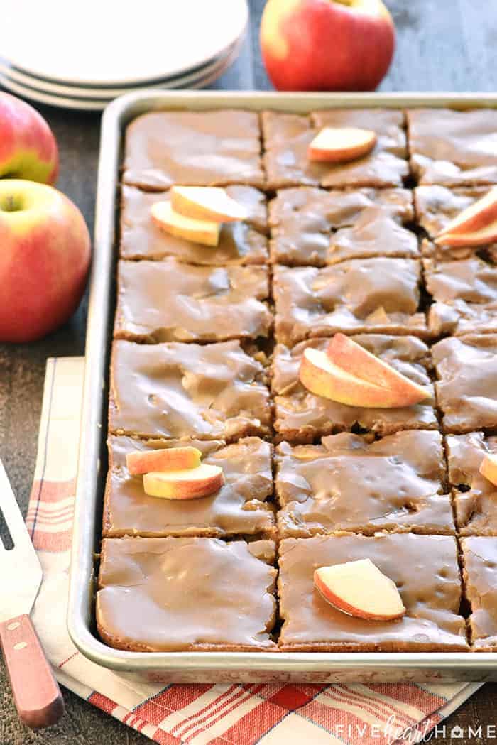Caramel Apple Sheet Cake in pan garnished with apples