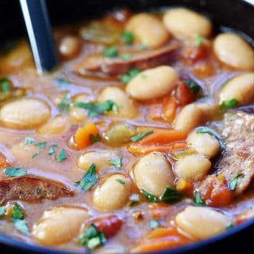 Slow Cooker Cajun White Bean Soup ~ a cozy crock pot recipe loaded with beans, andouille sausage, veggies, and a flavorful broth that's sure to warm you up! | FiveHeartHome.com