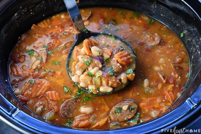 Cajun Bean Soup being ladled from slow cooker.