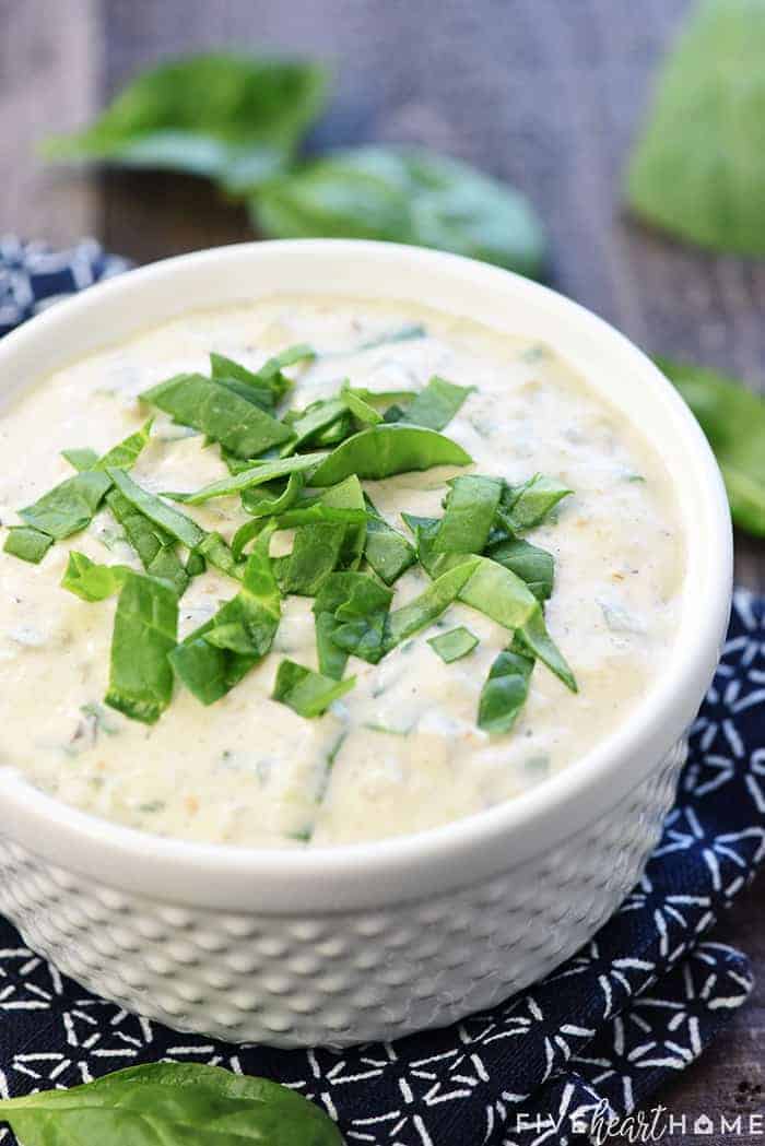 White Queso recipe with spinach on top.