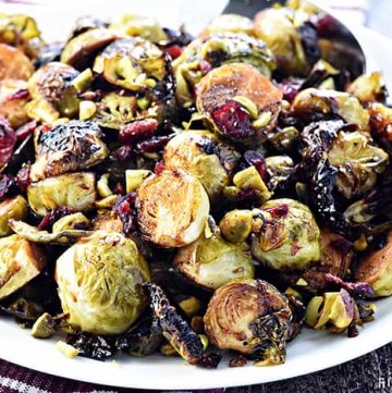 Balsamic Roasted Brussels Sprouts with Pistachios & Cranberries ~ crispy and addictive, this special holiday side dish recipe is perfect for Thanksgiving or Christmas but also easy enough for everyday! | FiveHeartHome.com