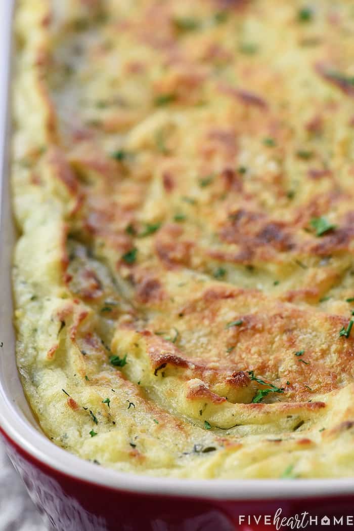 Close-up of Make Ahead Mashed Potatoes in baking dish.