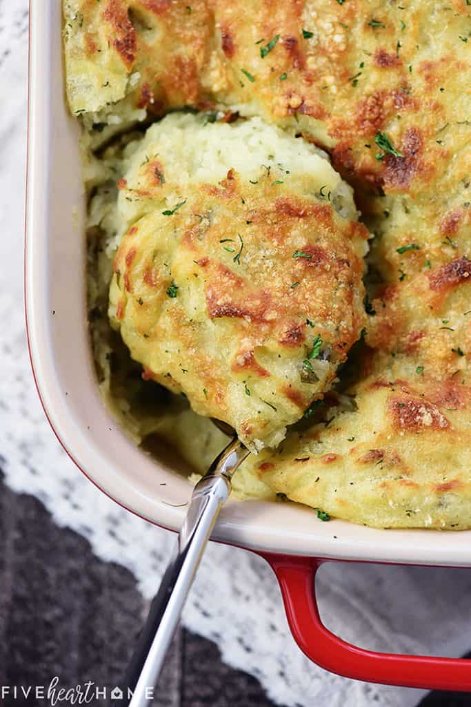 Serving spoon of Make-Ahead Mashed Potatoes.