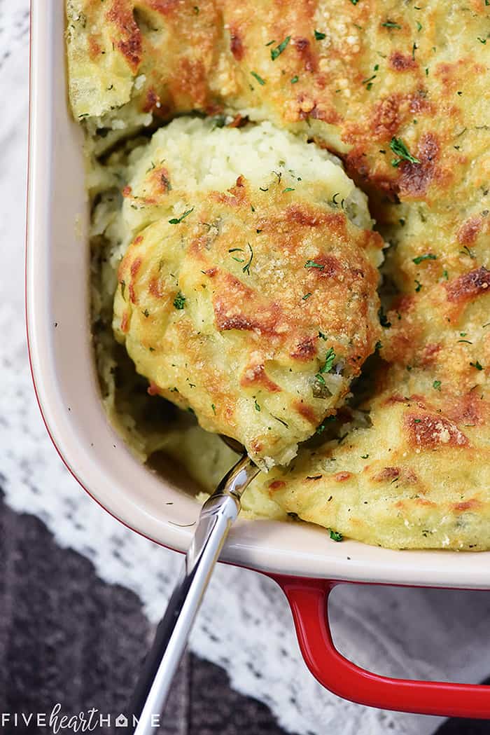 Serving spoon of Make-Ahead Mashed Potatoes.