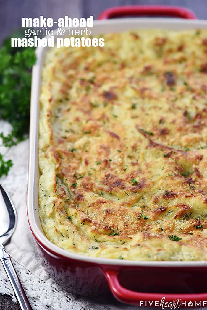 Make-Ahead Garlic & Herb Mashed Potatoes ~ a creamy, decadent holiday side dish loaded with mellow garlic & fresh herbs and topped with a golden Parmesan crust...perfect for Thanksgiving, Christmas, Easter, or entertaining company! | FiveHeartHome.com