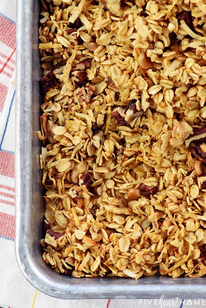 Healthy Pumpkin Granola ~ crunchy, golden, and easy to make, loaded with wholesome oats, toasty nuts, real pumpkin puree, coconut oil, maple syrup, & warm fall spices! | FiveHeartHome.com Aerial View of Pumpkin Granola in Baking Sheet
