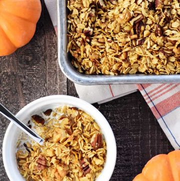 Healthy Pumpkin Granola ~ crunchy, golden, and easy to make, loaded with wholesome oats, toasty nuts, real pumpkin puree, coconut oil, maple syrup, & warm fall spices! | FiveHeartHome.com