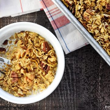 Healthy Pumpkin Granola ~ crunchy, golden, and easy to make, loaded with wholesome oats, toasty nuts, real pumpkin puree, coconut oil, maple syrup, & warm fall spices! | FiveHeartHome.com