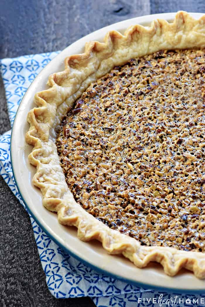 The BEST Pecan Pie ~ foolproof and perfect every time, with an abundance of toasty pecans floating on a thick, glossy filling in a flaky, all-butter pie crust! | FiveHeartHome.com