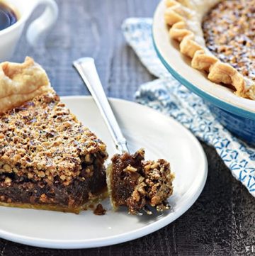 The BEST Pecan Pie ~ foolproof and perfect every time, with an abundance of toasty pecans floating on a thick, glossy filling in a flaky, all-butter pie crust! | FiveHeartHome.com