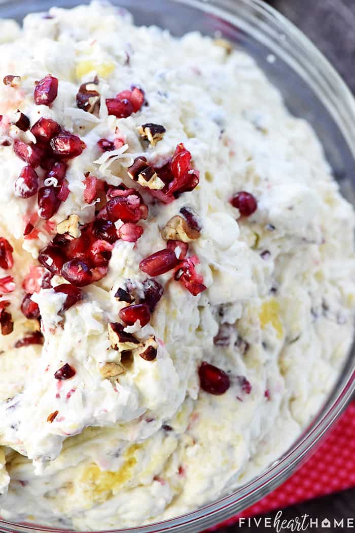 Ariel view of Cranberry Fluff Salad garnished with nuts and pomegranate.