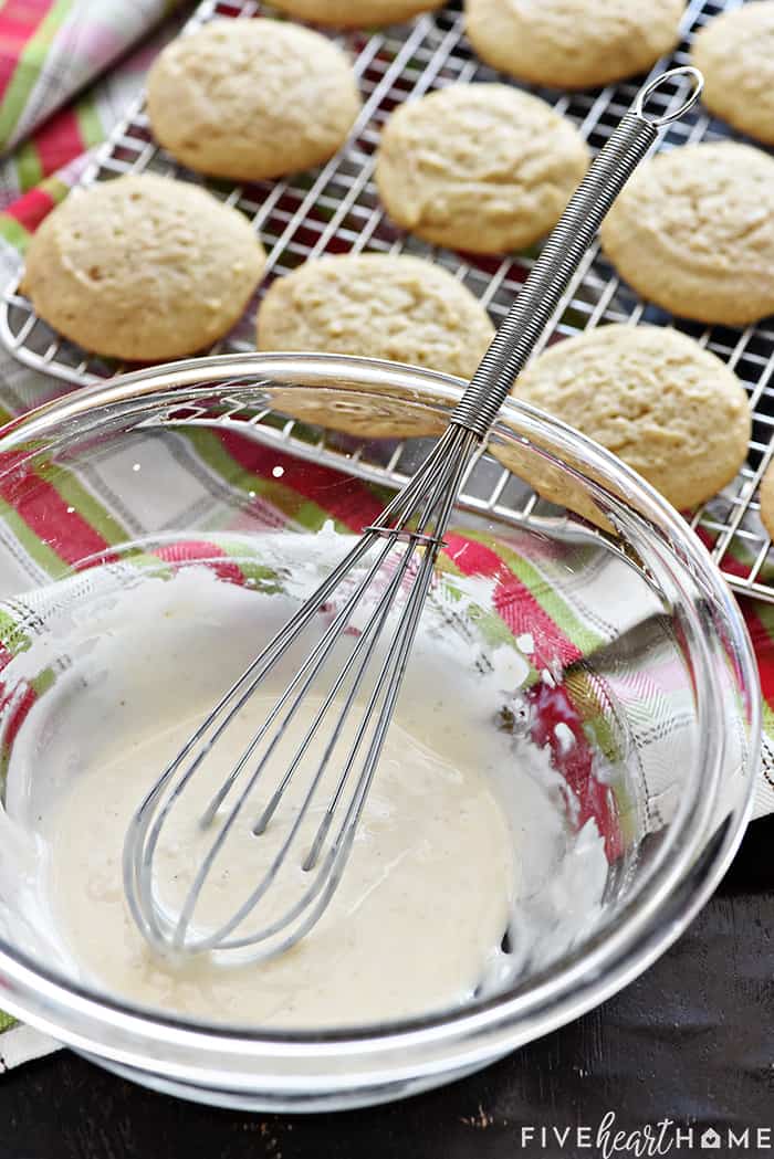 Bowl of glaze next to cooling rack.