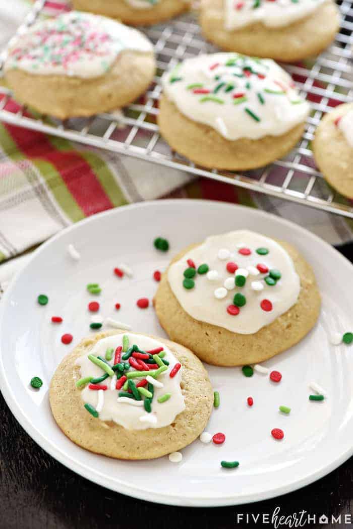 Eggnog Cookies on plate and cooling rack, decorated with Christmas sprinkles.