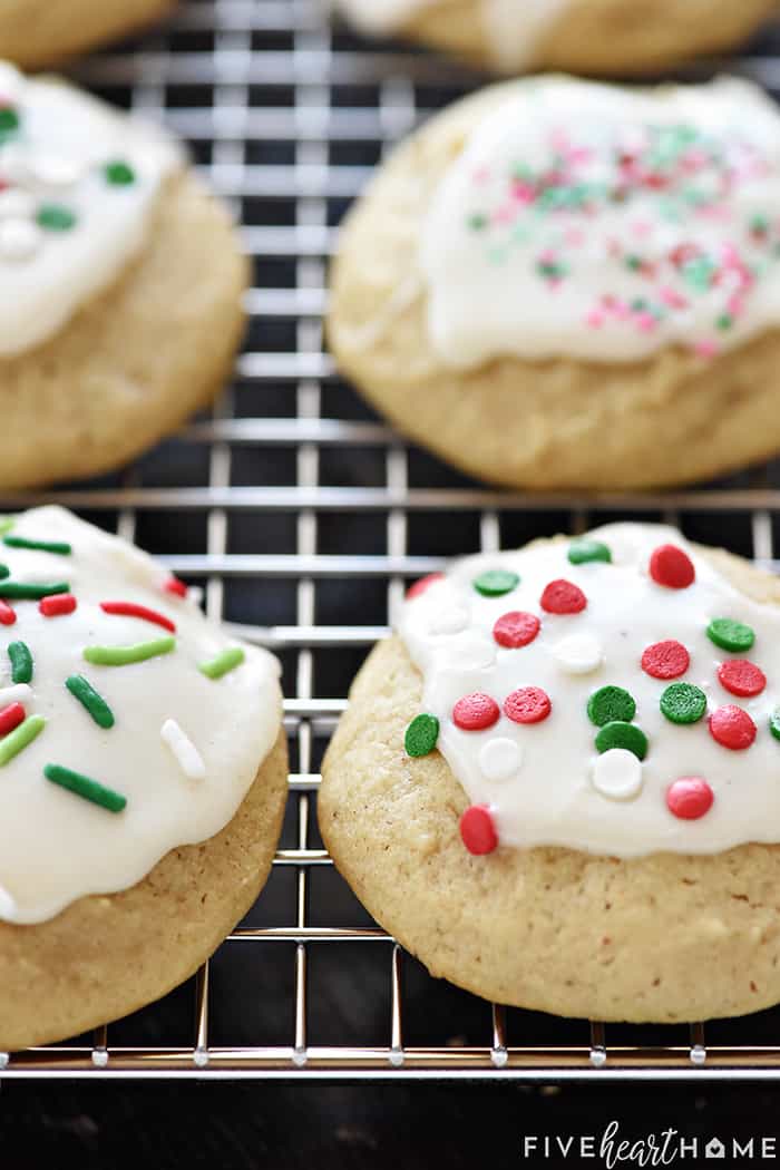 Close-up of Eggnog Cookies on cooling rack with Christmas sprinkles.