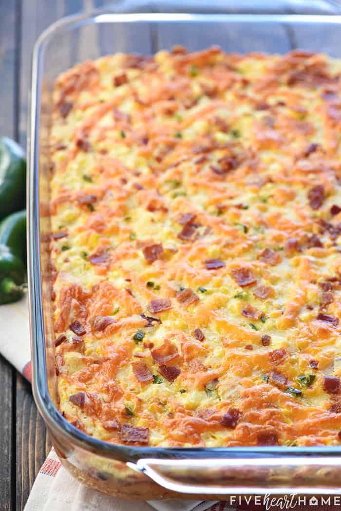 Ultimate Cornbread Casserole ~ with the addition of bacon, cheddar, and jalapeño, this flavorful, from-scratch recipe takes the classic side dish to a whole new level! | FiveHeartHome.com Cornbread Casserole recipe in a baking dish.