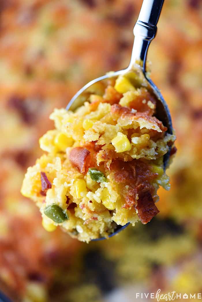 Spoonful of Cornbread Casserole showing corn, bacon, cheese, and jalapeños.