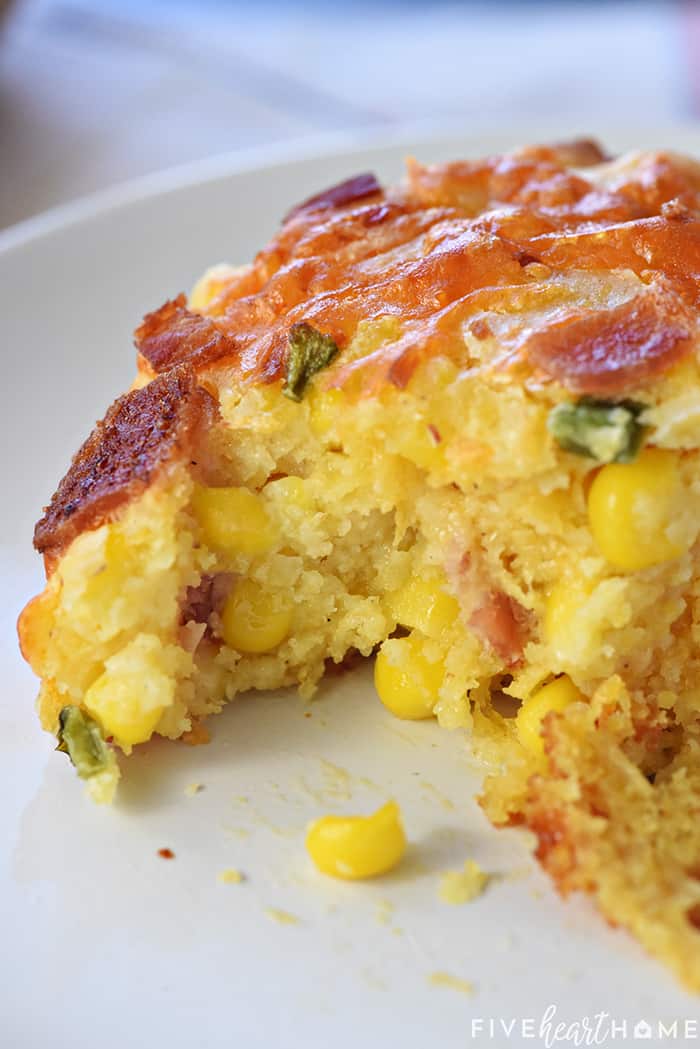 Ultimate Cornbread Casserole ~ with the addition of bacon, cheddar, and jalapeño, this flavorful, from-scratch recipe takes the classic side dish to a whole new level! | FiveHeartHome.com On a plate with missing bite.