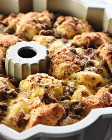 Bacon Cheeseburger Monkey Bread ~ loaded with ground beef, bacon, and cheddar, this gooey, savory, pull-apart recipe is a perfect appetizer for the Super Bowl or any party! | FiveHeartHome.com