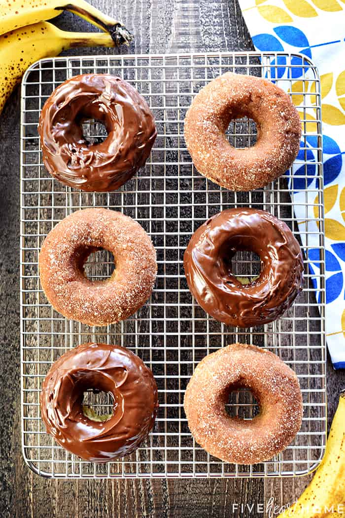 Aerial view of six Baked Donuts on a rack with bananas on table