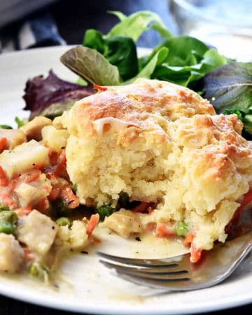 Chicken Pot Pie Casserole ~ this easy comfort food recipe features a classic filling of tender chicken, potatoes, carrots, and peas in a savory gravy topped with fluffy homemade drop biscuits! | FiveHeartHome.com