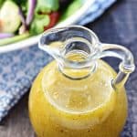 Homemade Greek Salad Dressing ~ tangy, easy to make, and delicious drizzled over a Greek salad with tomatoes, cucumbers, Kalamata olives, onions, and Feta! | FiveHeartHome.com