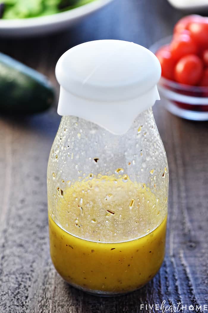 Homemade Greek Salad Dressing shaken up in a bottle.