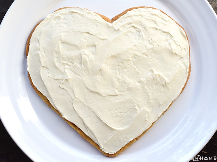 Crust spread with cream cheese frosting.