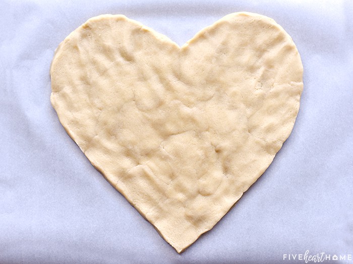 Sugar cookie dough pressed into a heart crust.