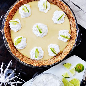 Key Lime Pie with Pretzel Crust & Coconut Whipped Cream ~ a classic Key Lime Pie filling is taken over the top with a sweet and salty pretzel crust and fresh coconut whipped cream! | FiveHeartHome.com