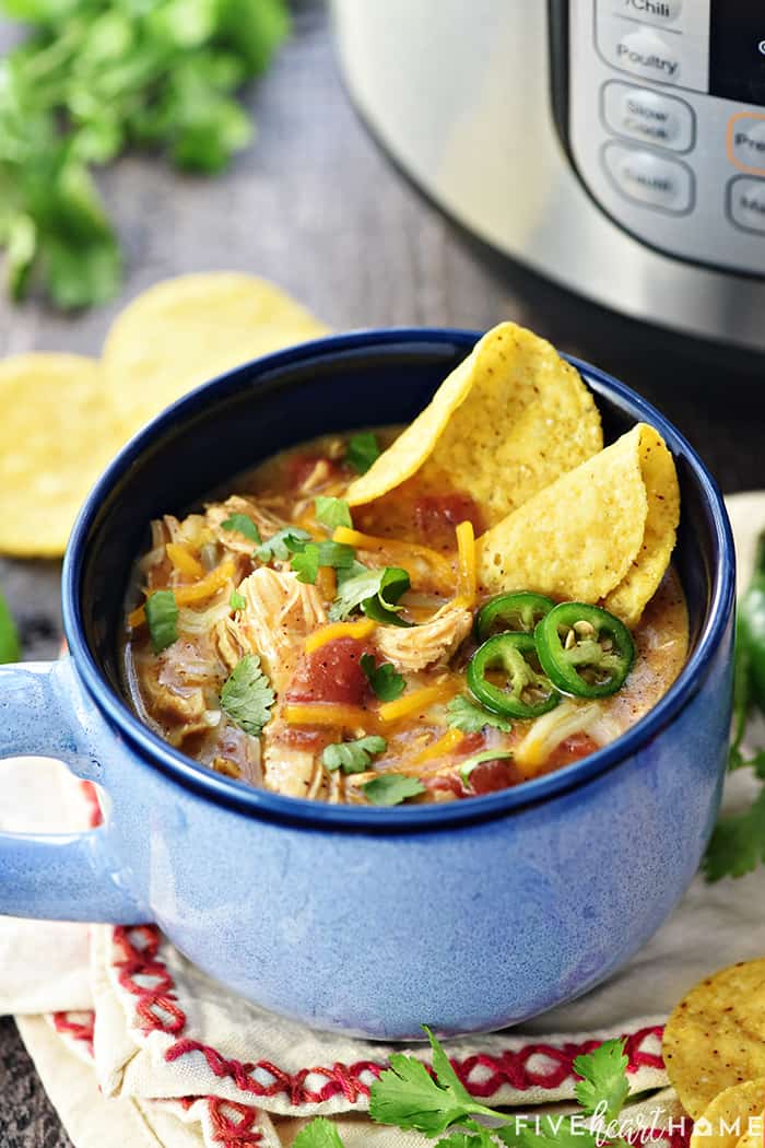 Garnished bowl in front of Instant Pot.