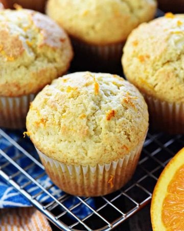 Orange Muffins ~ these lovely muffins are tender, and easy to make from scratch, with delicate flavors of vanilla and citrus from fresh orange juice and zest! | FiveHeartHome.com