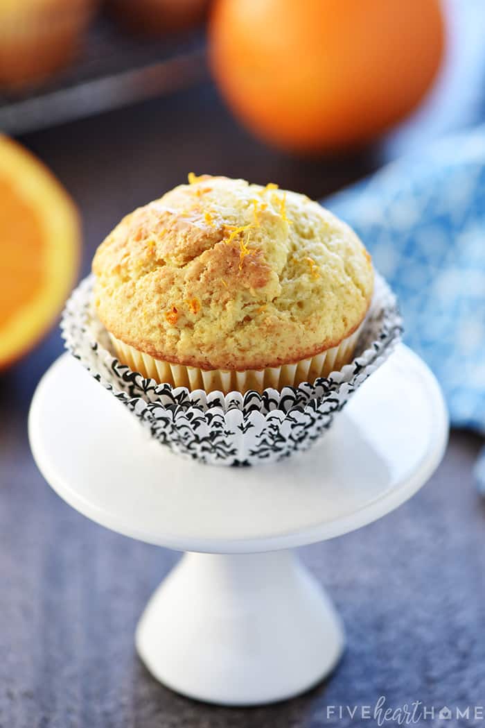Orange Muffins ~ these lovely muffins are tender, and easy to make from scratch, with delicate flavors of vanilla and citrus from fresh orange juice and zest! | FiveHeartHome.com Close-up on mini cupcake stand.
