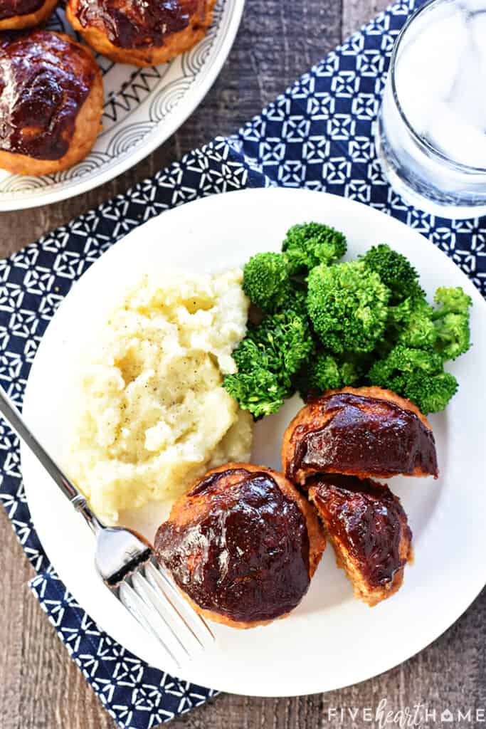 Aerial view of Turkey Meatloaf Muffins on dinner plate and serving platter.