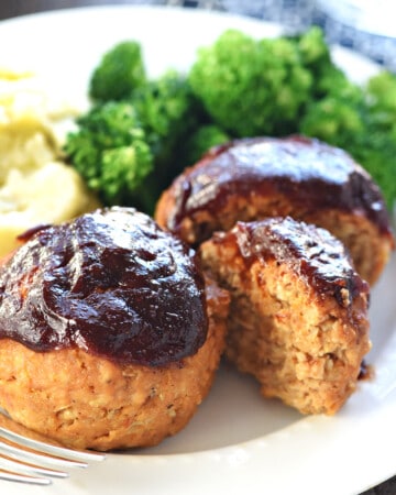 Turkey Meatloaf Muffins on dinner plate with veggies.