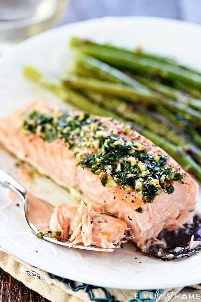 Forkful of Oven Baked Salmon on plate.