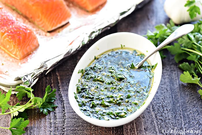 Oven Baked Salmon with Garlic & Parsley ~ a flavorful, delicious recipe that comes together in a flash, perfect for impressing company or as a go-to weeknight dinner! | FiveHeartHome.com Bowl of garlic parsley sauce made with olive oil.