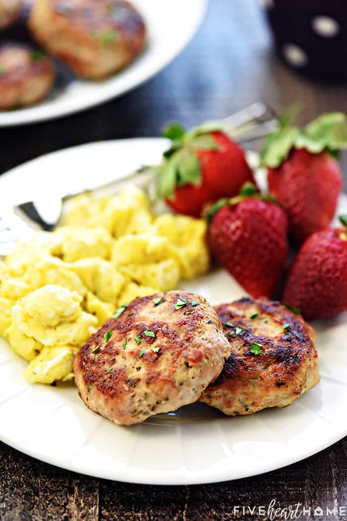 Breakfast Sausage on a plate with eggs and strawberries